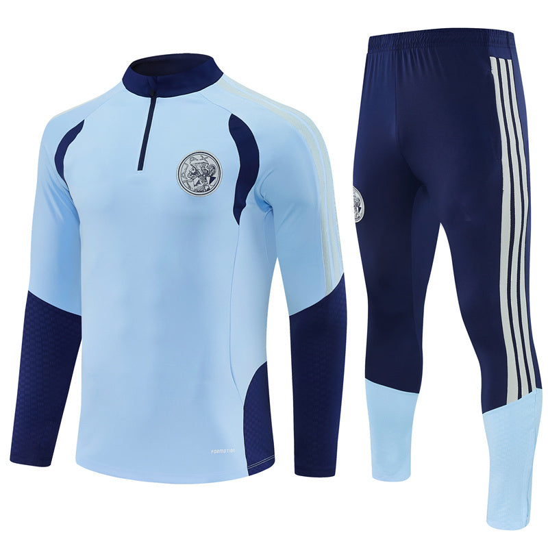 Ajax 26/27 Light Blue/Navy Training Tracksuit Set