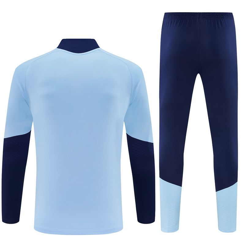 Ajax 26/27 Light Blue/Navy Training Tracksuit Set