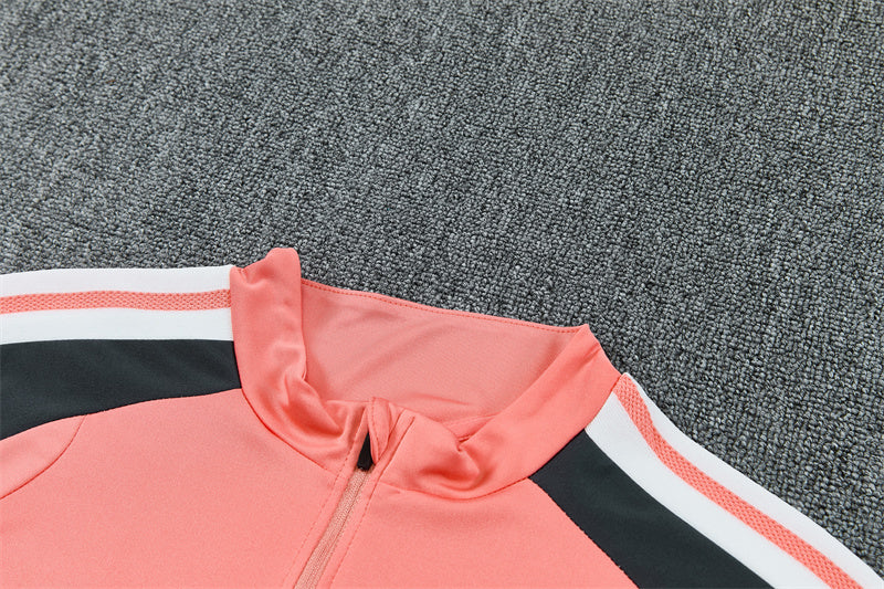 Real Madrid 26/27 Coral Pink/Dark Gray Tracksuit Set